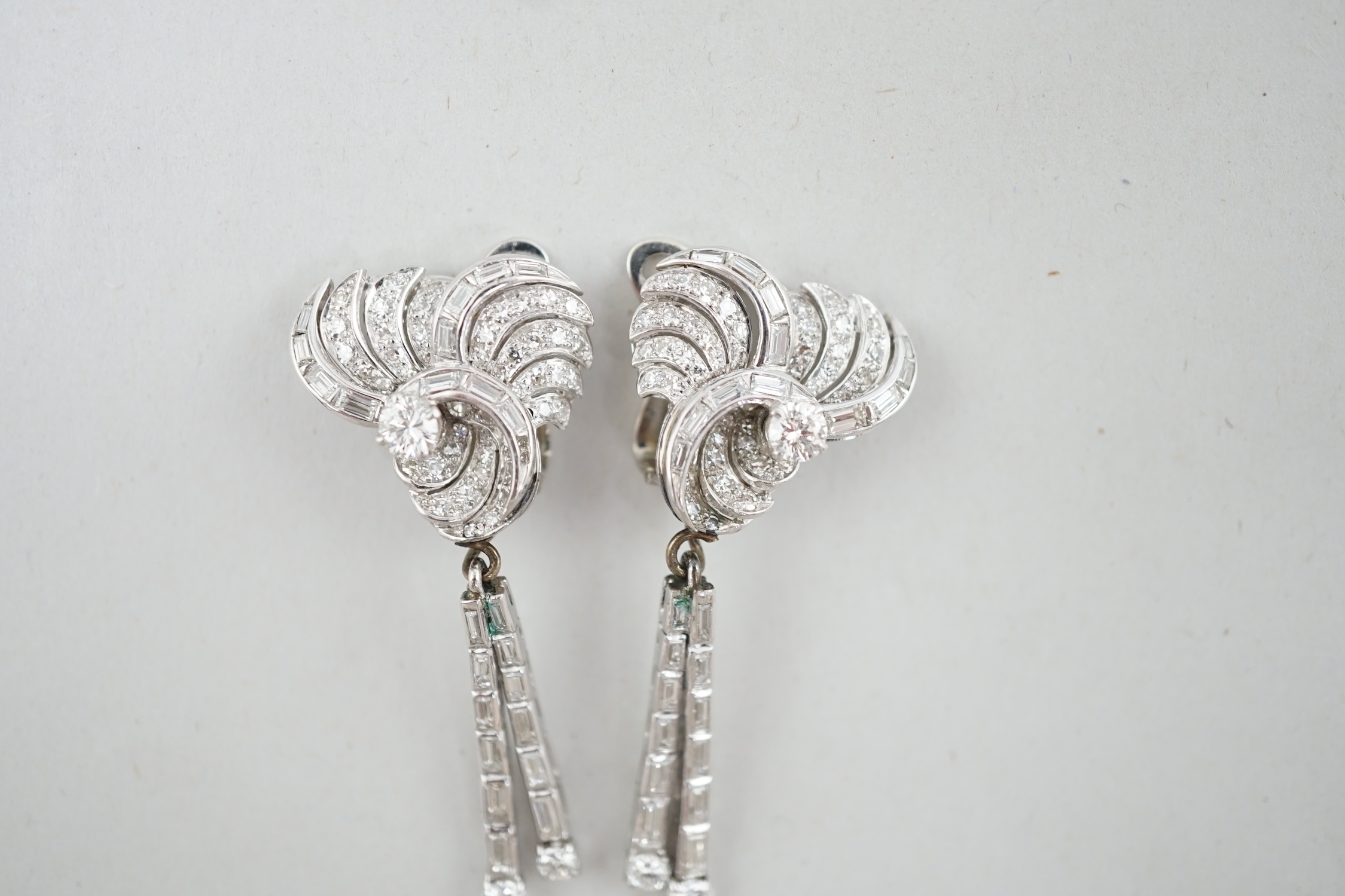 A pair of 1960's white gold and diamond cluster set drop ear clips